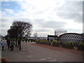 View over Greenwich, a gasometer on Millennium Way and a sculpture from the path to the Emirates Air Line