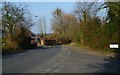 Looking north on Stoneham Lane across the junction with Channels Farm Road