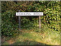 TM5199 : Dorking Road sign by Geographer