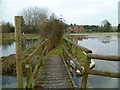 Footbridge and path by watercress beds in Headbourne Worthy