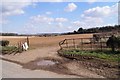 Battered farm gate