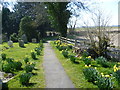 TR0534 : The path leading to St Rumwold's Church in springtime by Marathon