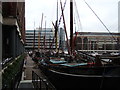 View of a plethora of boats moored up at St Katharine Dock