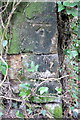 Benchmark on wall near East House, Aynho Road