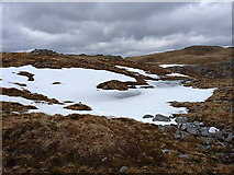 NH0124 : Snow drifts and peaty pools by Richard Law