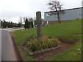 SS6501 : Stone cross outside the Arla dairy by David Smith