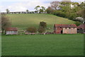 Beehives and farm buildings by The Poplars