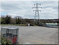 Electricity pylon at the edge of the Aldi site in Tir-y-berth