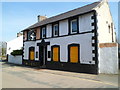 Boarded-up former Quarryman