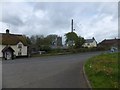 Thatched house and village buildings by A386 in Merton