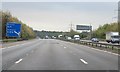 TQ5065 : M25 one mile to junction 4 sign by Julian P Guffogg
