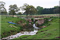 Pond with a dam near Park Cottage on the Scrivelsby Estate