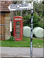 ST6520 : Poyntington: phone box and finger-post by Chris Downer