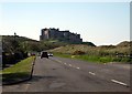 Links Road heading in to Bamburgh passing the Armstrong Cottages on the way