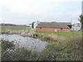 TQ6743 : Pond and outbuildings, Mascalls Court Farm by John Baker