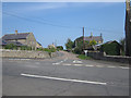 NU1328 : Road junction in Warenford by Graham Robson