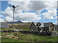 NM7164 : Wind turbine and houses at Resipole by M J Richardson