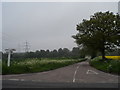 Cross roads, signpost and power lines