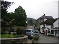 St Neot looking towards London Inn and tree in church yard.