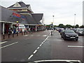 Car park and entrance to Tesco store on Kettering Retail Park