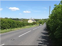 J0216 : View eastwards along the B113 (Newry Road) by Eric Jones