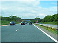 NY5326 : M6 northbound approaches the WCML railway bridge by Colin Pyle