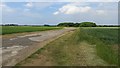 NT5080 : Airfield road, RAF Drem by Richard Webb
