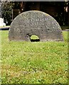 Millstone used as a headstone, All Saints