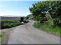 Farm sheds on the winding Ballynamona Road