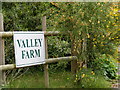 TM3983 : Valley Farm sign by Geographer