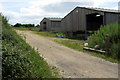 Farm buildings by the footpath