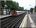 Tube train leaving South Ealing station