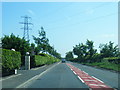 Power lines cross the A7 south of Longtown