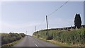 SN9776 : Road passing cemetery at Nant Gwyn by John Firth