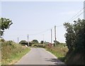 Road passing phone box at Felinwynt