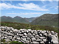 J2922 : The summit of Slievenaglogh from the Mourne Wall stile by Eric Jones