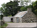 Traditional stone built and tin sheet-roofed cottage on the Ballydrumman Road