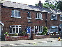 TA0979 : Cottage with scarecrows on West Street, Muston by JThomas