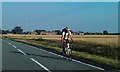 SD3402 : Cyclist along the road at Lunt by Mike Pennington