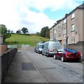 Two RCT Homes vans at the northern edge of residential Wattstown