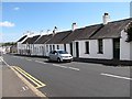 Painters at work on cottages in the High Street, Comber