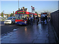 Boarding the 232 bus outside Arnos Grove tube station