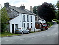 A4215 passes houses near the A470 junction SW of Libanus