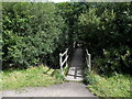 Wooden footbridge over the Rhondda Fach river between Tylorstown and Ferndale