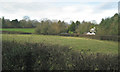 Field and a house by Rising Lane north of Kingswood