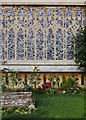 TL8646 : Flint flushwork and flowerbeds, Long Melford parish church by Stefan Czapski