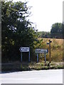 TM3589 : Roadsigns & footpaths on the B1062 Beccles Road by Geographer