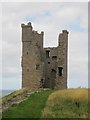 NU2521 : Lilburn Tower, Dunstanburgh Castle by Graham Robson