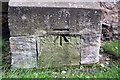 Benchmark on buttress of St Radegund