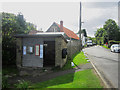 NU2419 : Bus shelter, Dunstan by Graham Robson